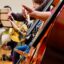 A group of people playing musical instruments in a room